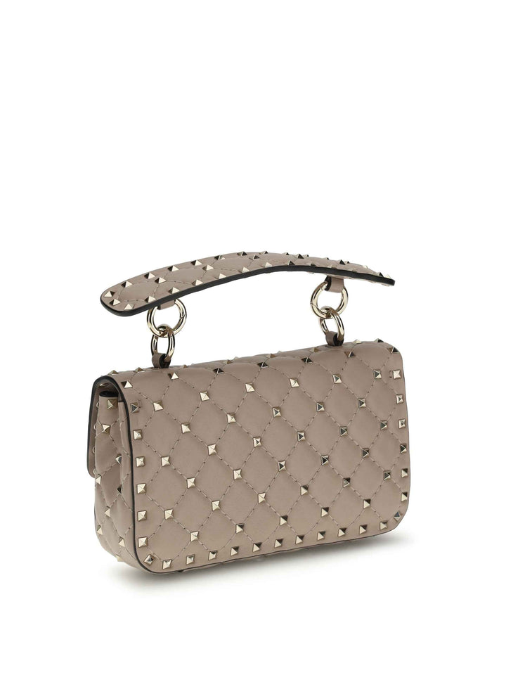 Rockstud Spike mini Top Handle Bag in nappa